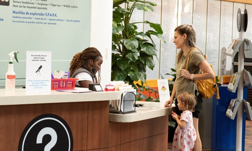A mom and a daughter at the information desk
