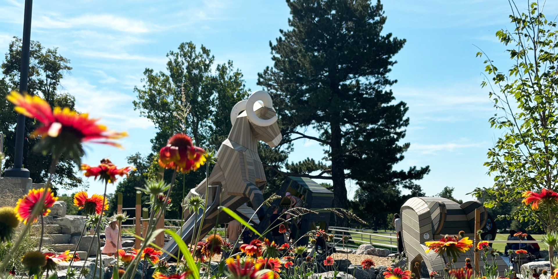 Flowers blooming in foreground; Ram structure in background
